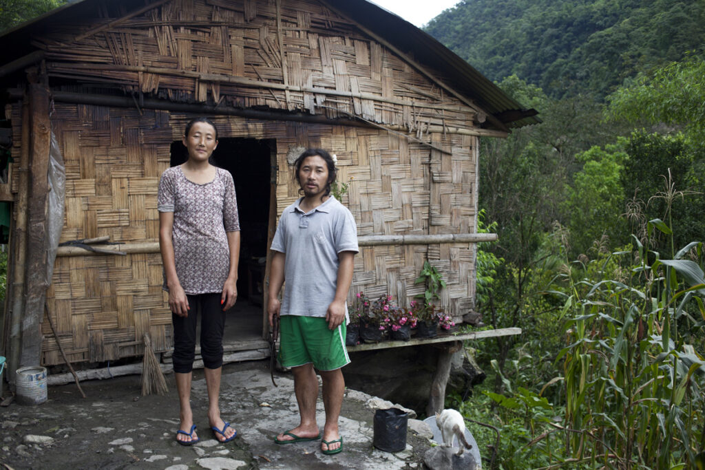 Lepcha anti-dam activist and farmer Tenzing Gyatso and his wife on their land close to the Rangyong Chu river.