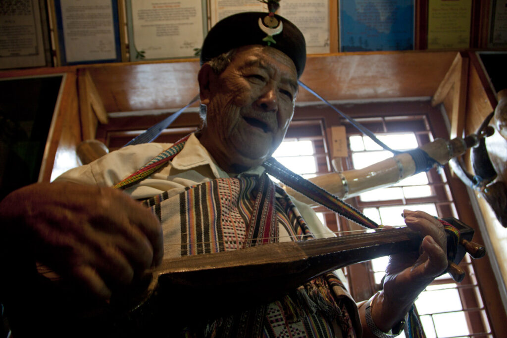 87 year old Sonam Tshering Lepcha, a cultural activist and composer plays a tune on a traditional instrument at the Lepcha museum in Kalimpong town, West Bengal.